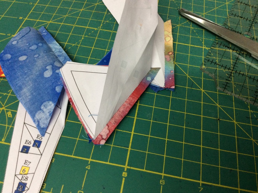 Fold back the paper template on seam line and trim the seam to 1/4